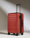a red suitcase with wheels