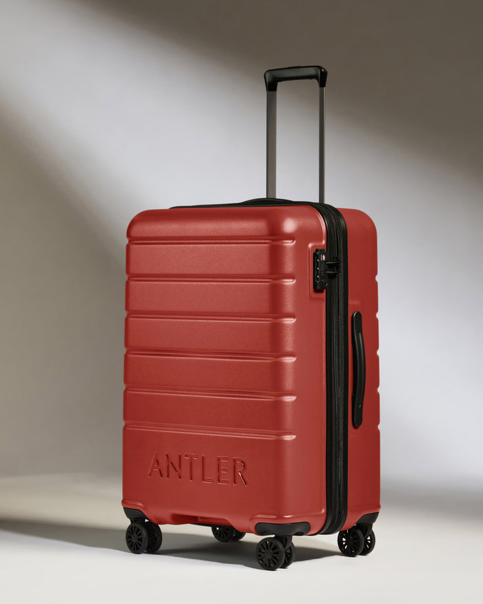 a red suitcase with wheels