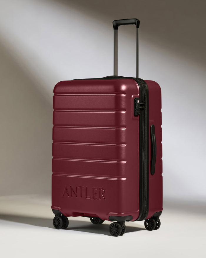 a red suitcase with two handles