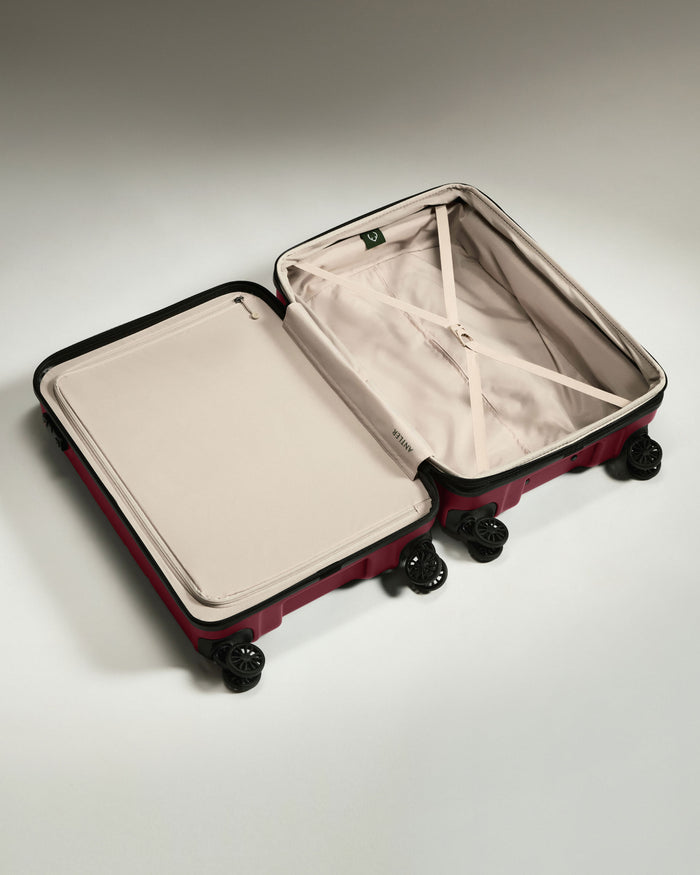 a suitcase with wheels and a lid