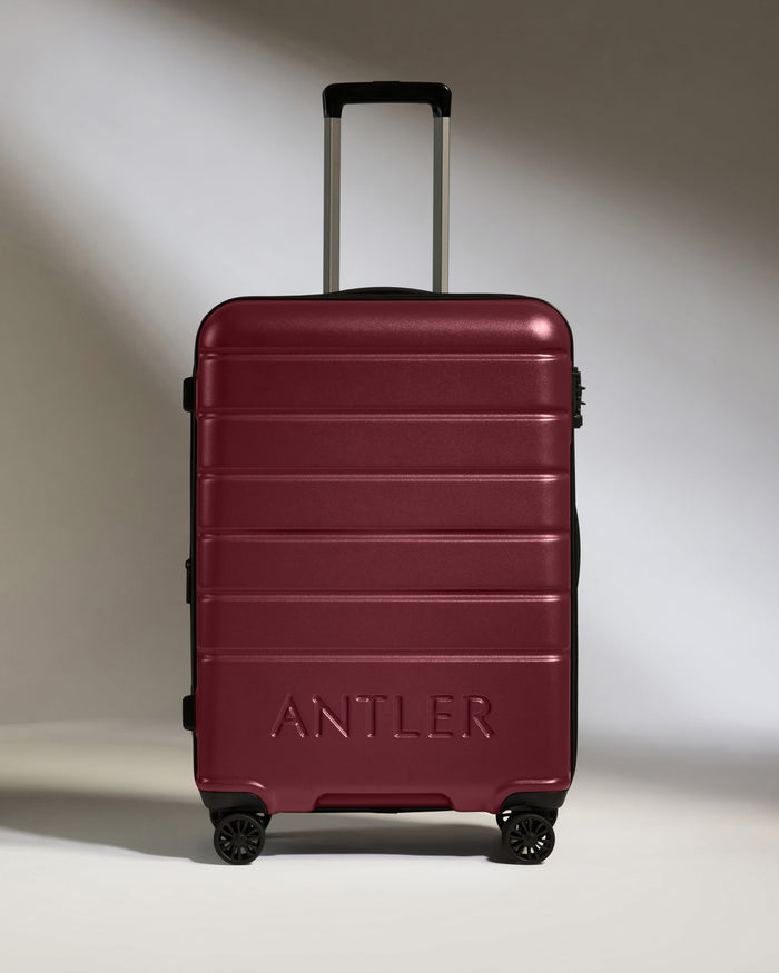 a red suitcase with handle