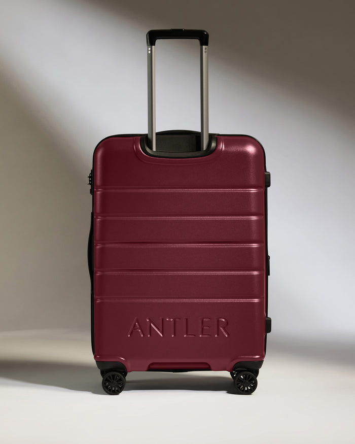 a red suitcase with handles