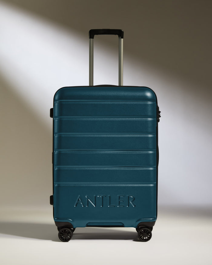 a blue suitcase with wheels