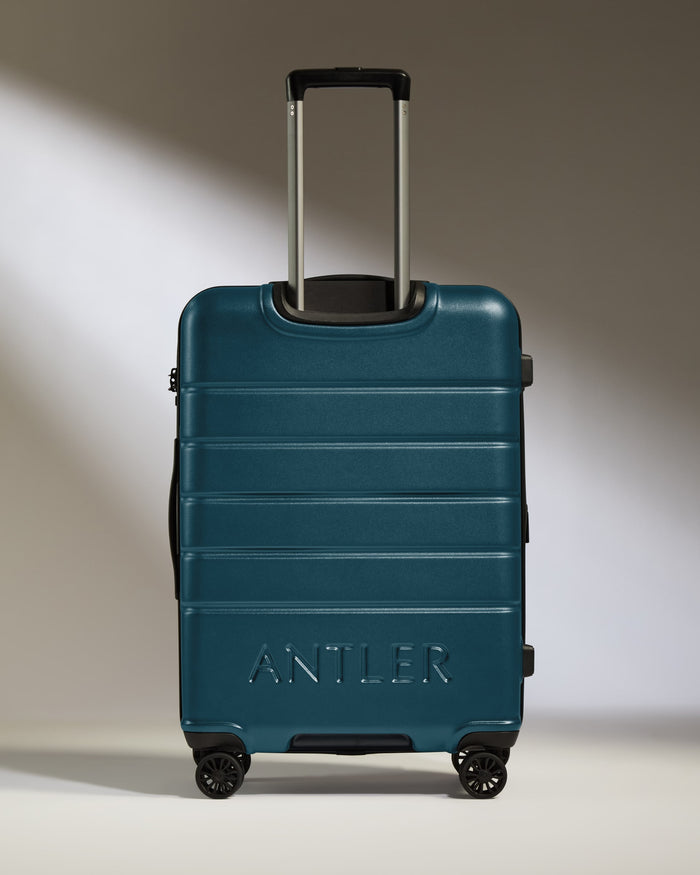 a blue suitcase with handle