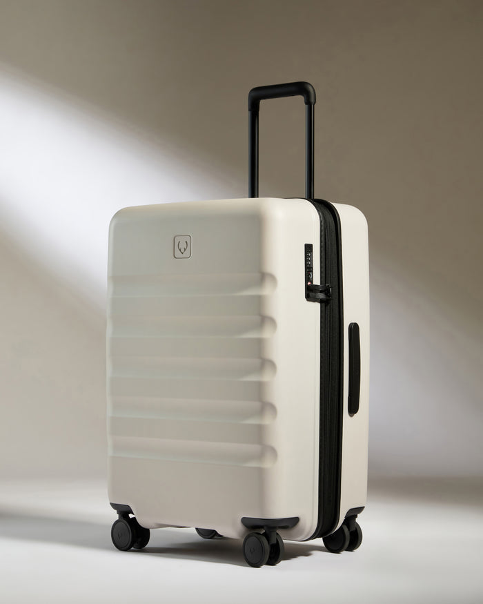 a white suitcase with wheels