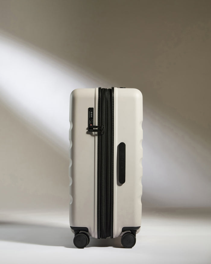 a white suitcase with wheels