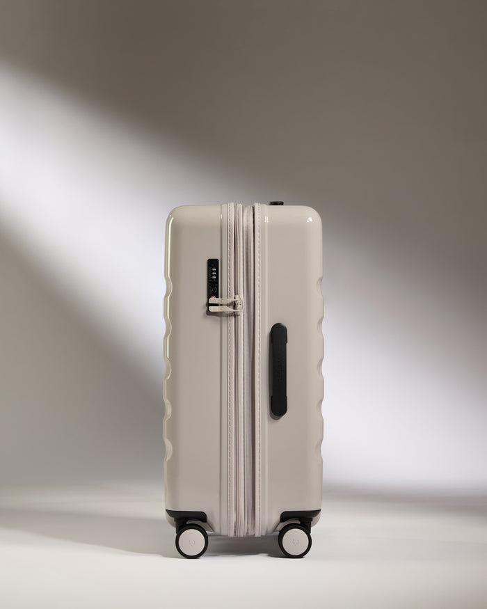 a white suitcase with wheels