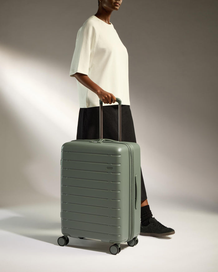 a woman holding a suitcase