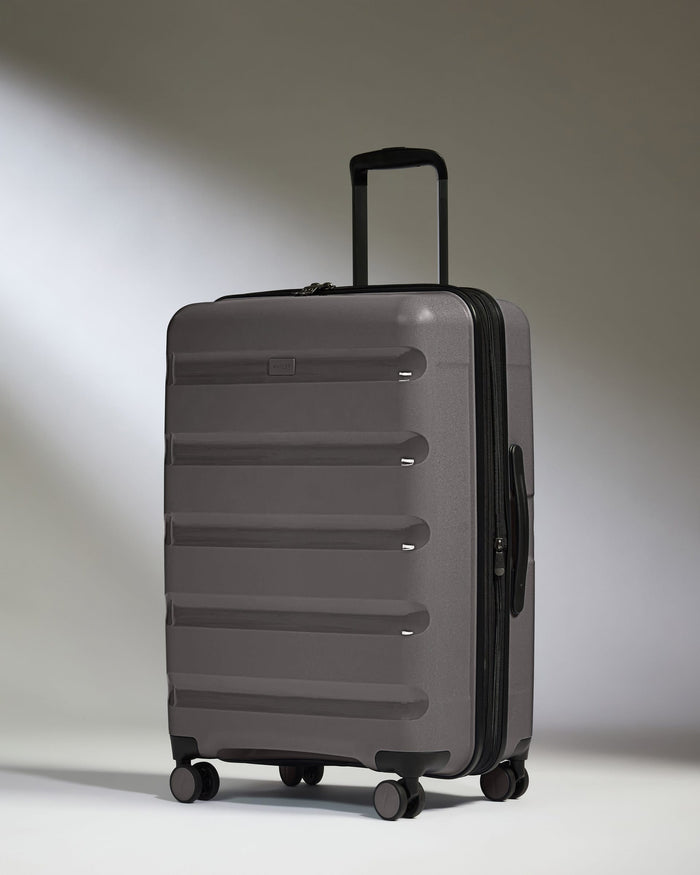 Antler Luggage -  Expandable Medium Suitcase in Gloss Gull Grey - Logo Stripe - Expanding Rollercase | Medium 4W Expandable Medium Suitcase in Gloss Gull Grey - Logo Stripe