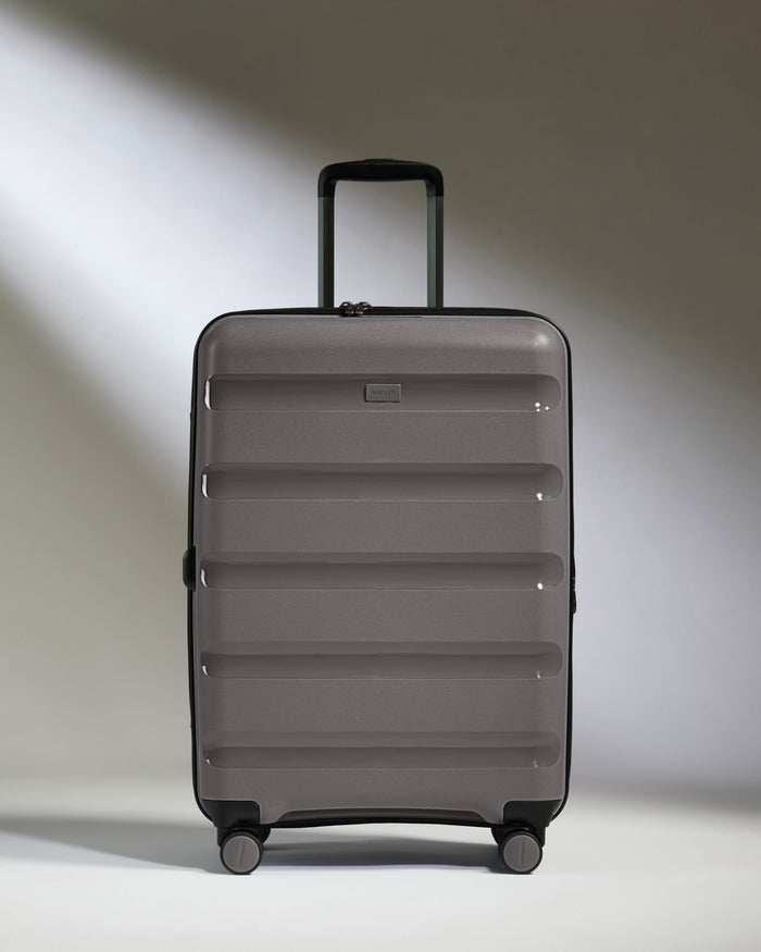 Antler Luggage -  Expandable Medium Suitcase in Gloss Gull Grey - Logo Stripe - Expanding Rollercase | Medium 4W Expandable Medium Suitcase in Gloss Gull Grey - Logo Stripe