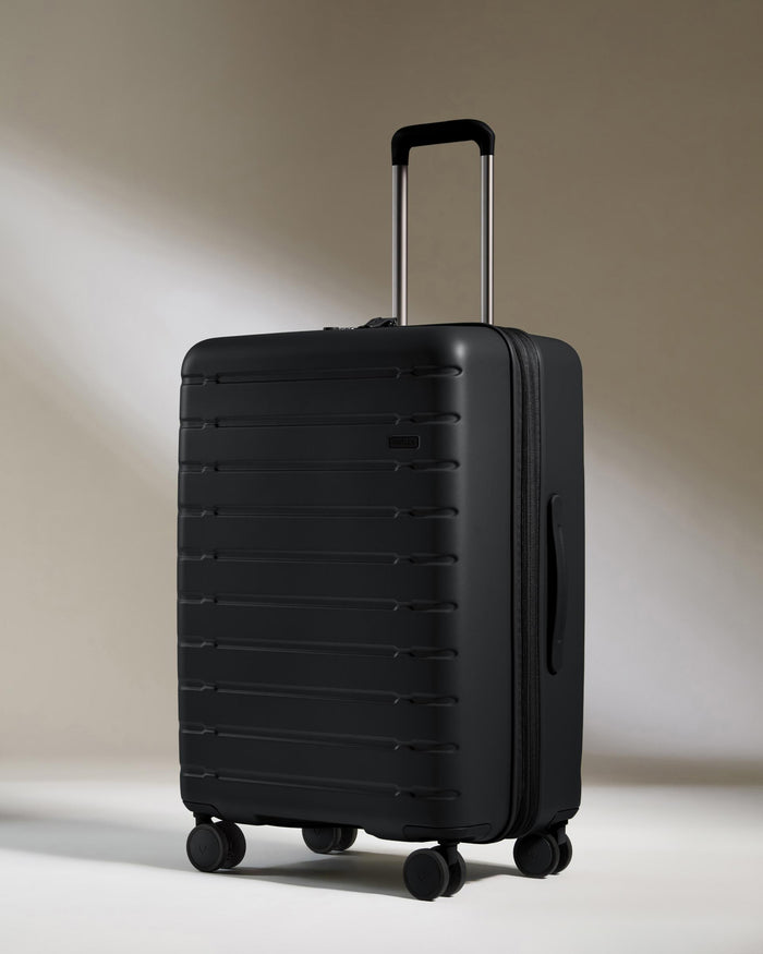 a black suitcase with wheels