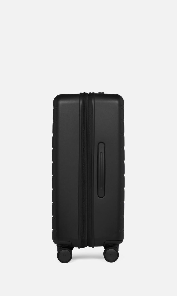 a black rectangular object with a zipper