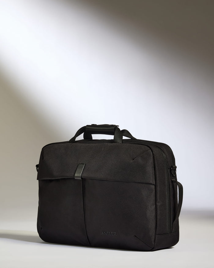 a black briefcase on a white surface