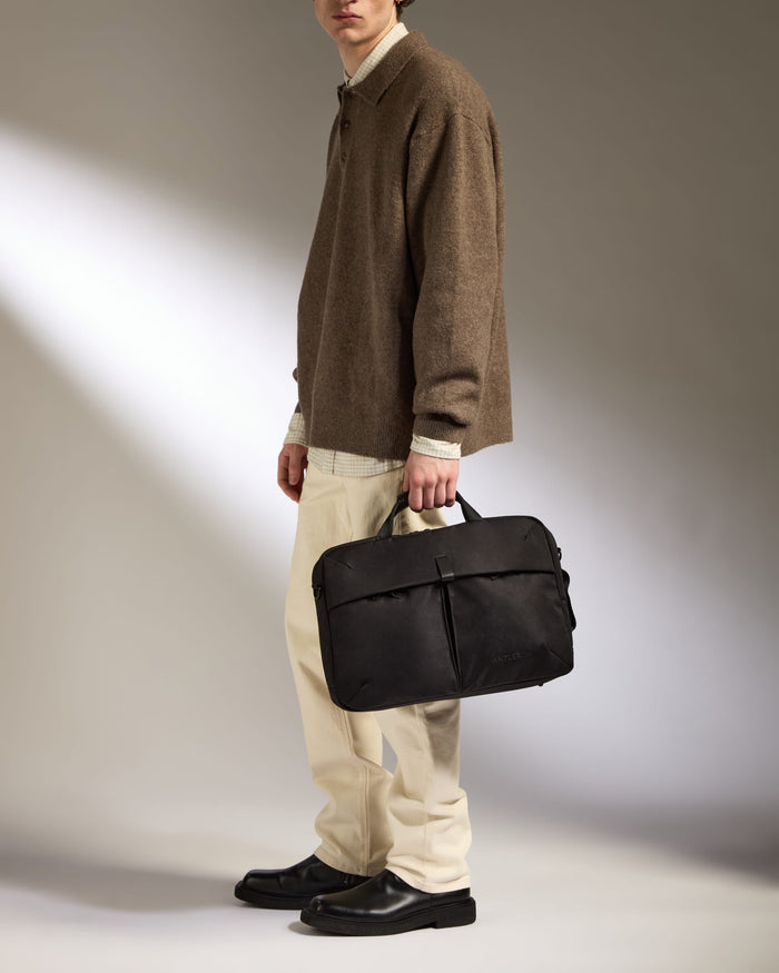 a man holding a briefcase