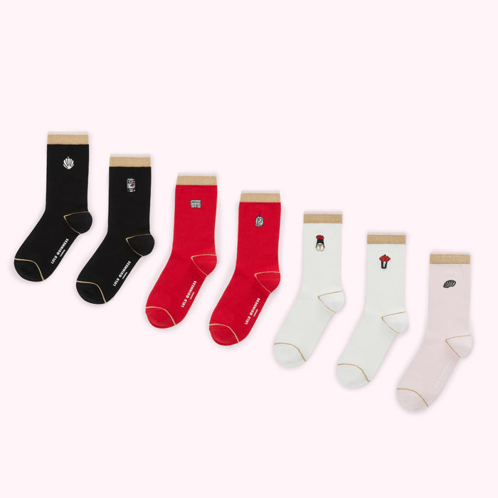 Six pairs of Lulu Guinness socks with different food-themed designs on a white background.