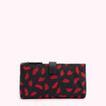 Black pouch with red lips pattern.