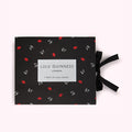 Black box with red lips pattern and Lulu Guinness London logo; 7 Days of Lulu Socks.