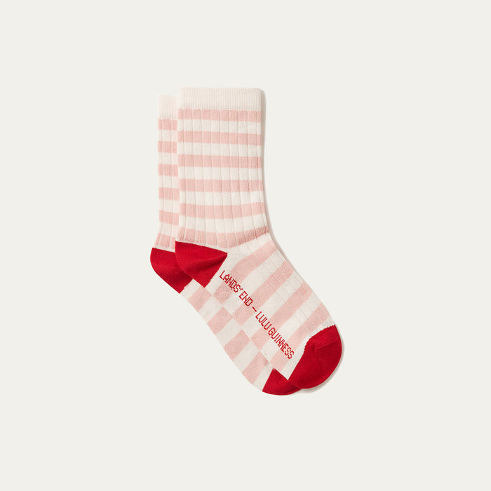 Pink and white striped sock with red accents on a light gray background
