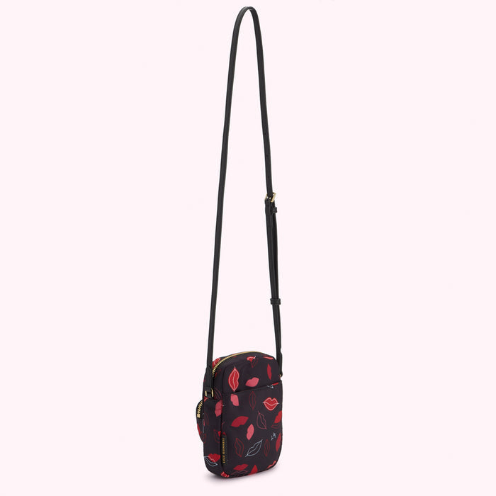 Black crossbody bag with red lips print.