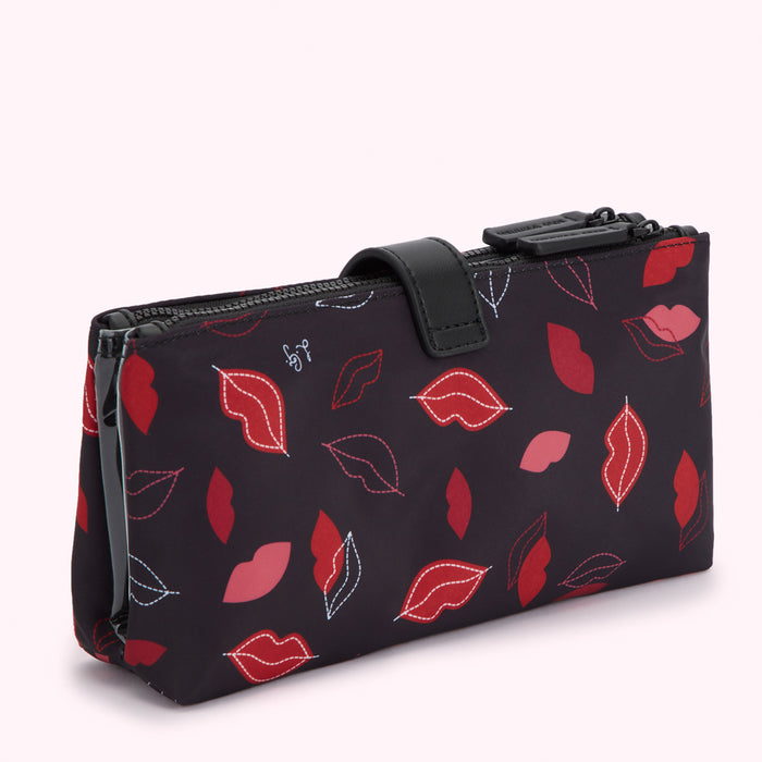 Black double zippered pouch with red lips pattern.