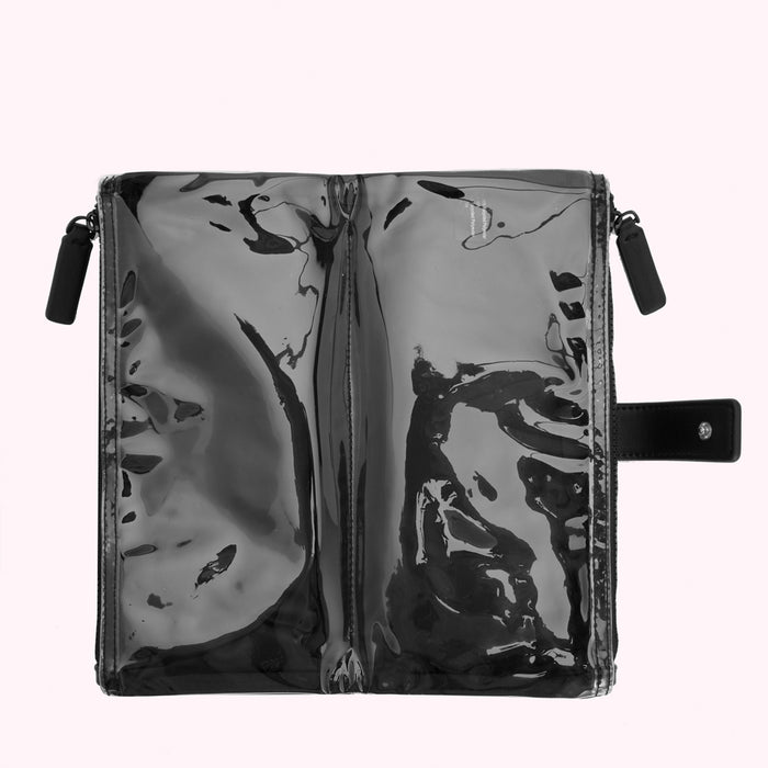 Black transparent zippered pouch with two compartments and a black leather strap.