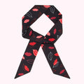 Black hair scarf with red lips print.