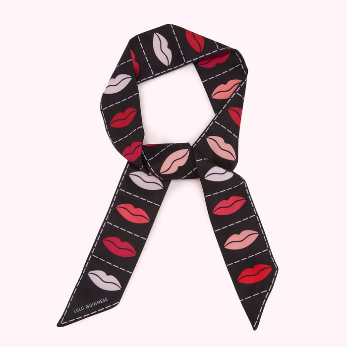 Black silk scarf with a pattern of red, pink, and white lips.