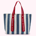 Blue and white striped tote bag with red Lulu Guinness branded straps.