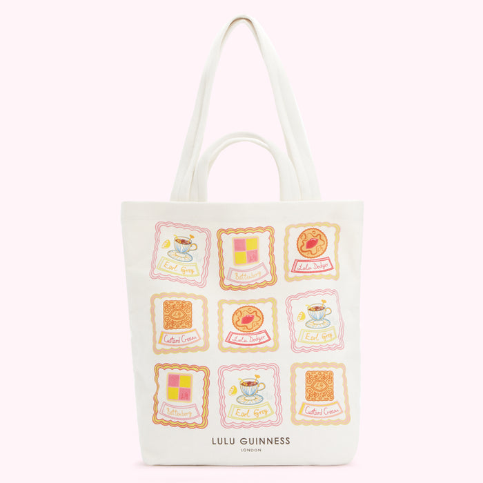 White tote bag with illustrations of biscuits and teacups; Lulu Guinness London.