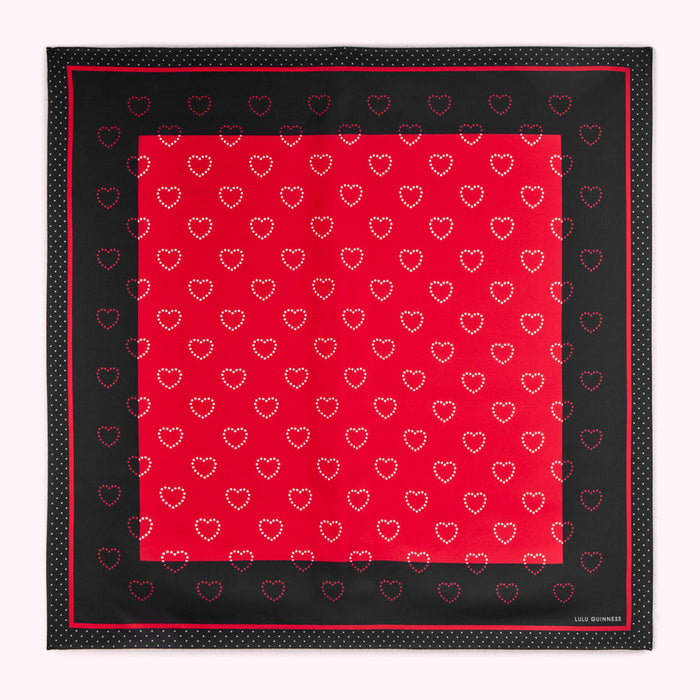 Red and black Lulu Guinness scarf with a heart pattern.
