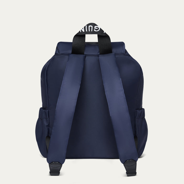 Navy blue backpack with a 'Lulu Guinness' logo on a light Grey background