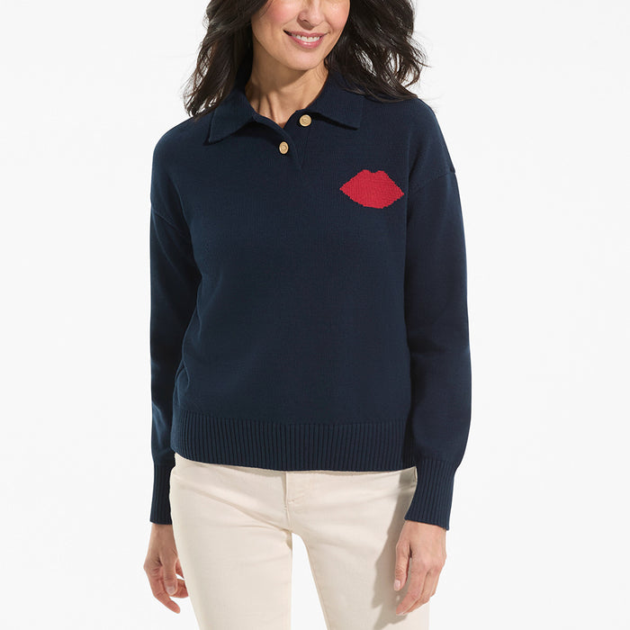 Navy sweater with red lip design worn by a person on a white background