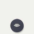 Navy compact mirror with silver lip design on a white background