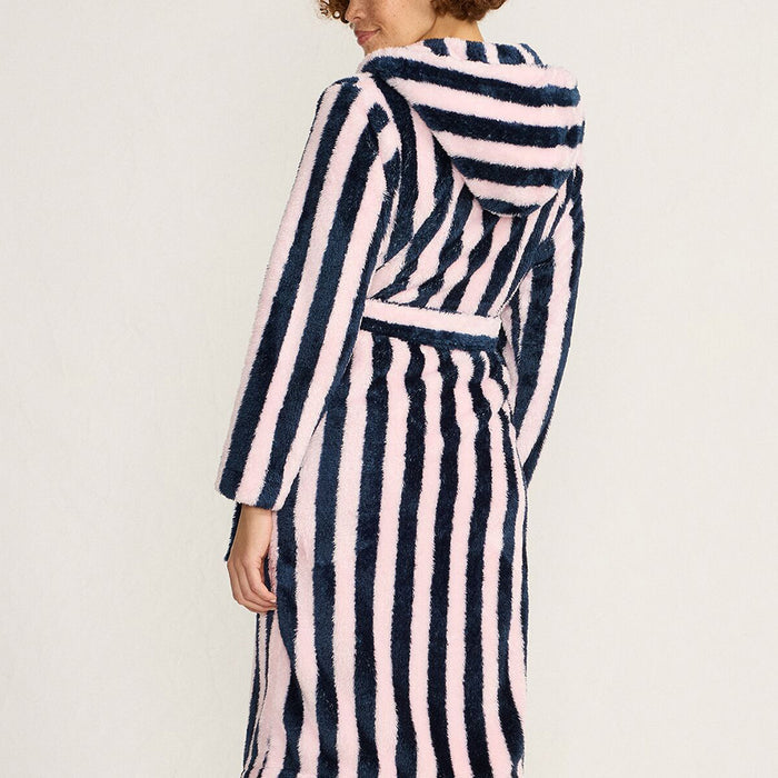 Women wearing a navy and pale pink striped robe with a red embroidered lip on a beige background
