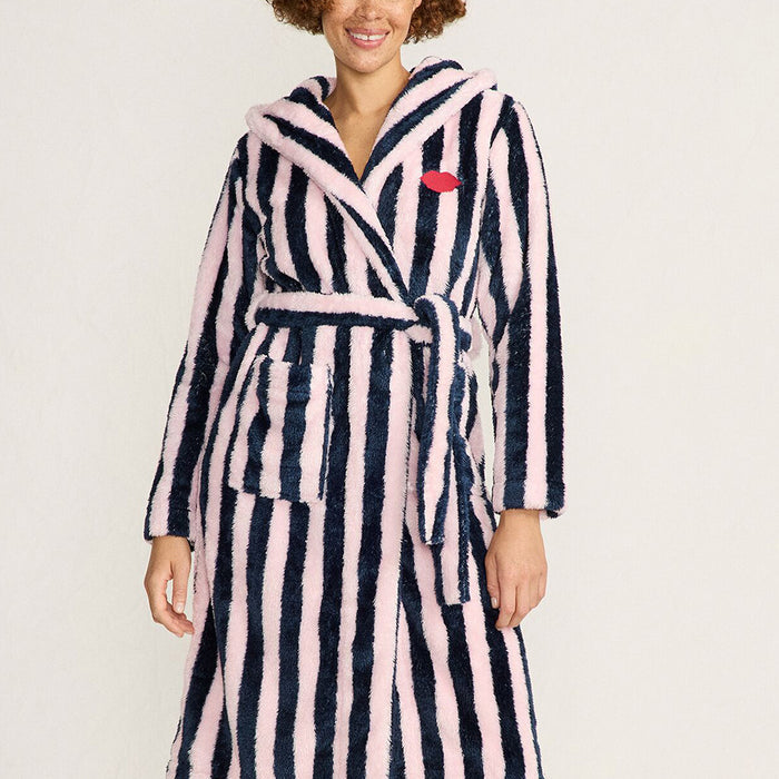 Women wearing a navy and pale pink striped robe with a red embroidered lip on a beige background