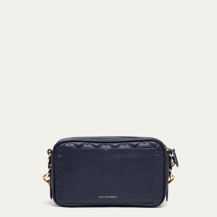 Navy blue leather crossbody bag with gold accents on a white background