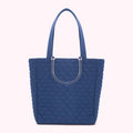 A navy blue quilted tote bag with clear handles.