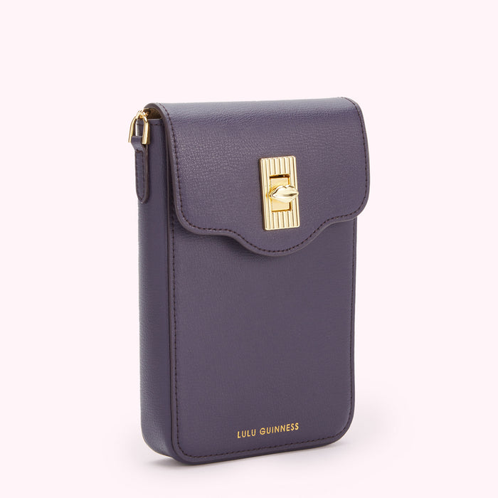 Purple Lulu Guinness crossbody bag with gold clasp.