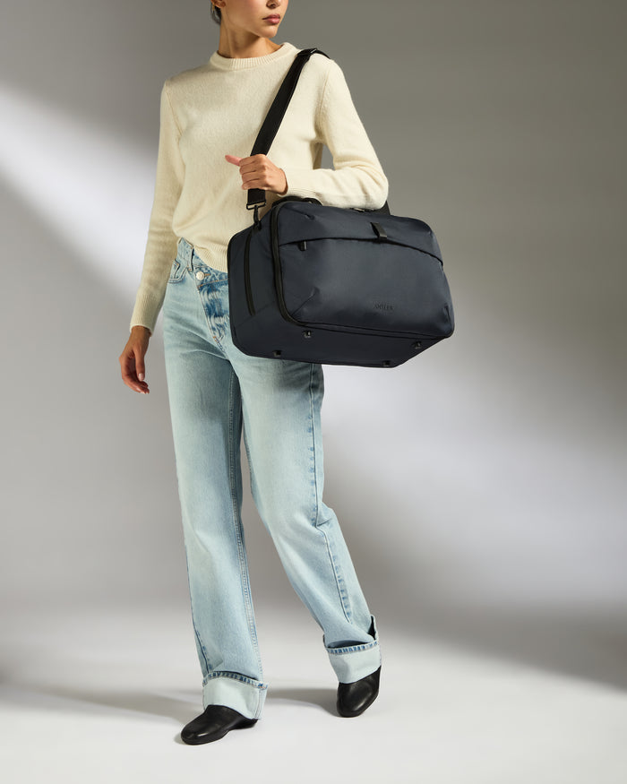a woman holding a bag