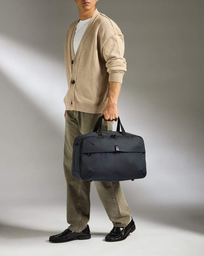 a man holding a bag