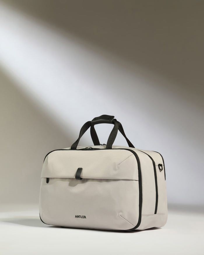 a white bag with black straps