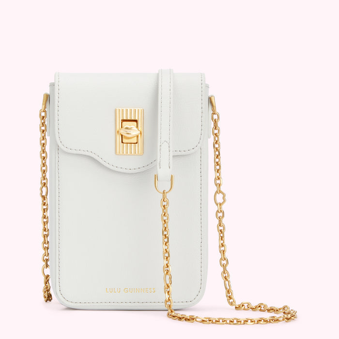 Off-white leather Lulu Guinness crossbody bag with gold chain strap and clasp.