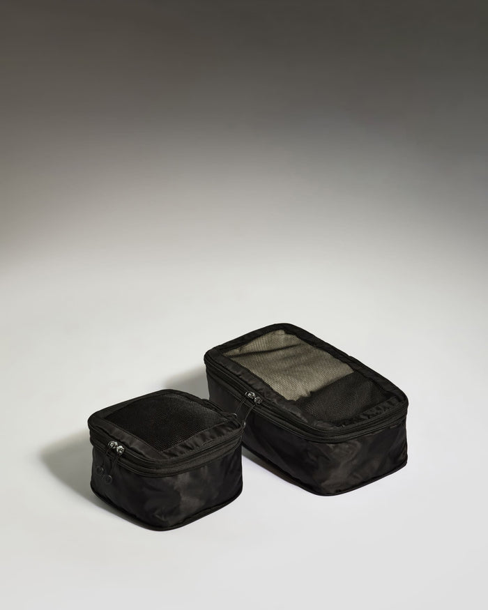 two black bags with a white background