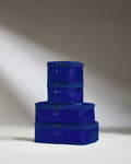 a stack of blue bags
