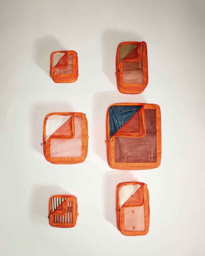 several orange bags on a white background