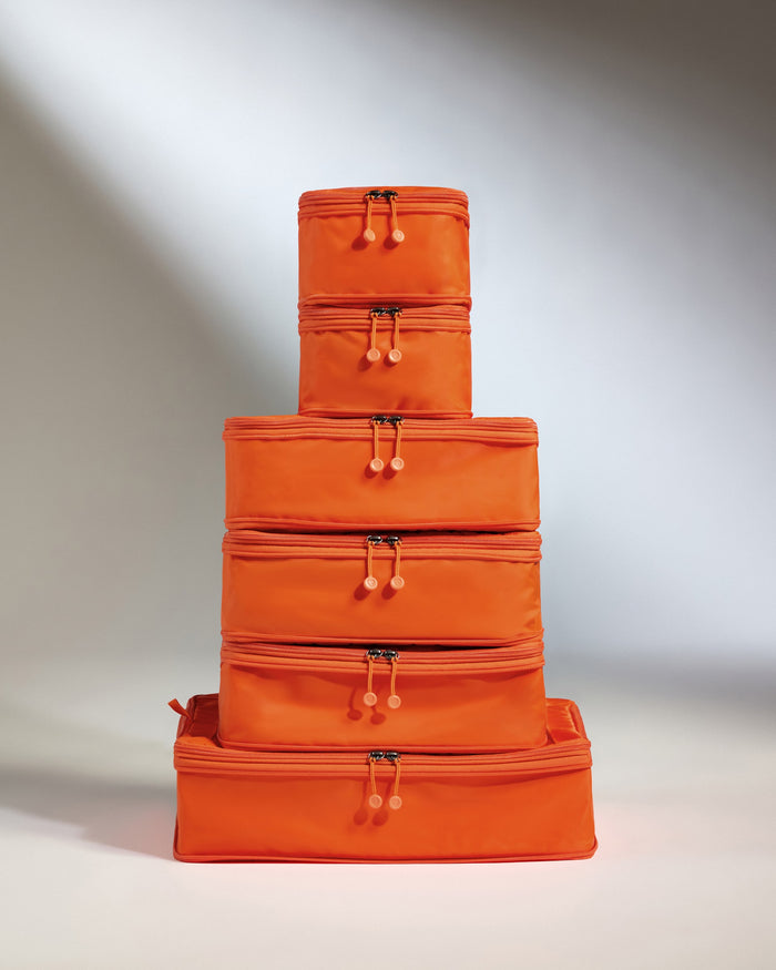 a stack of orange bags