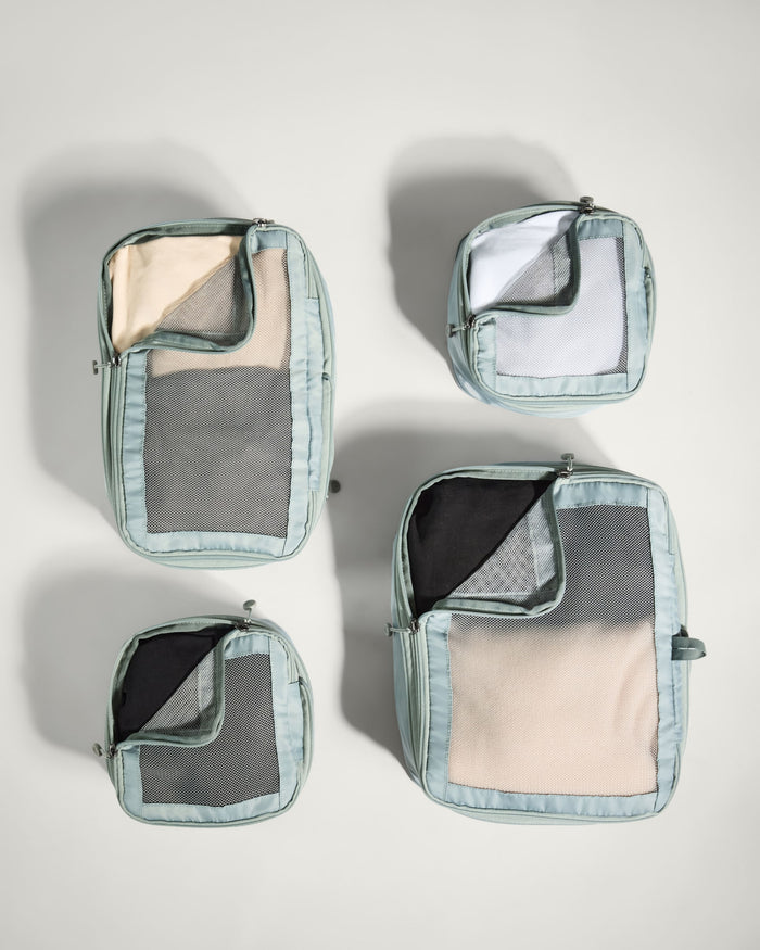 a group of bags with clothes inside