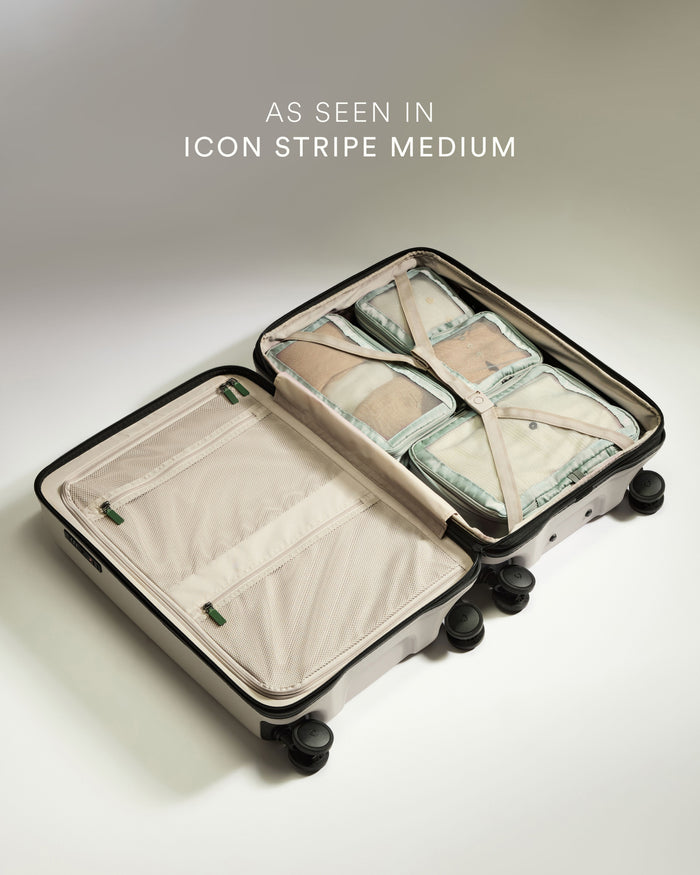 a suitcase with a few pieces of fabric