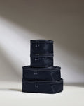 a stack of black bags