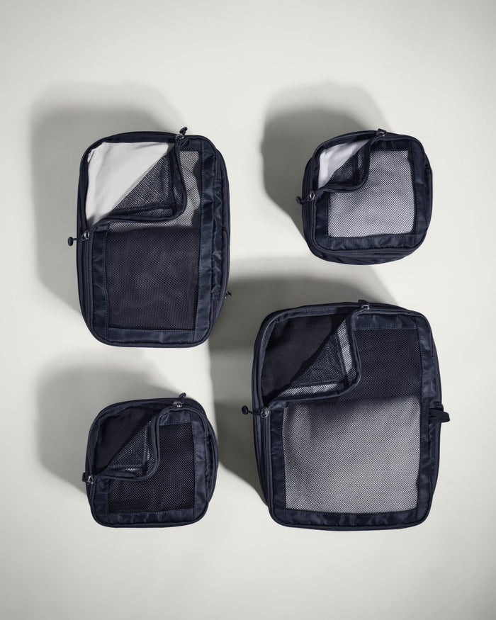 several black bags with mesh pockets